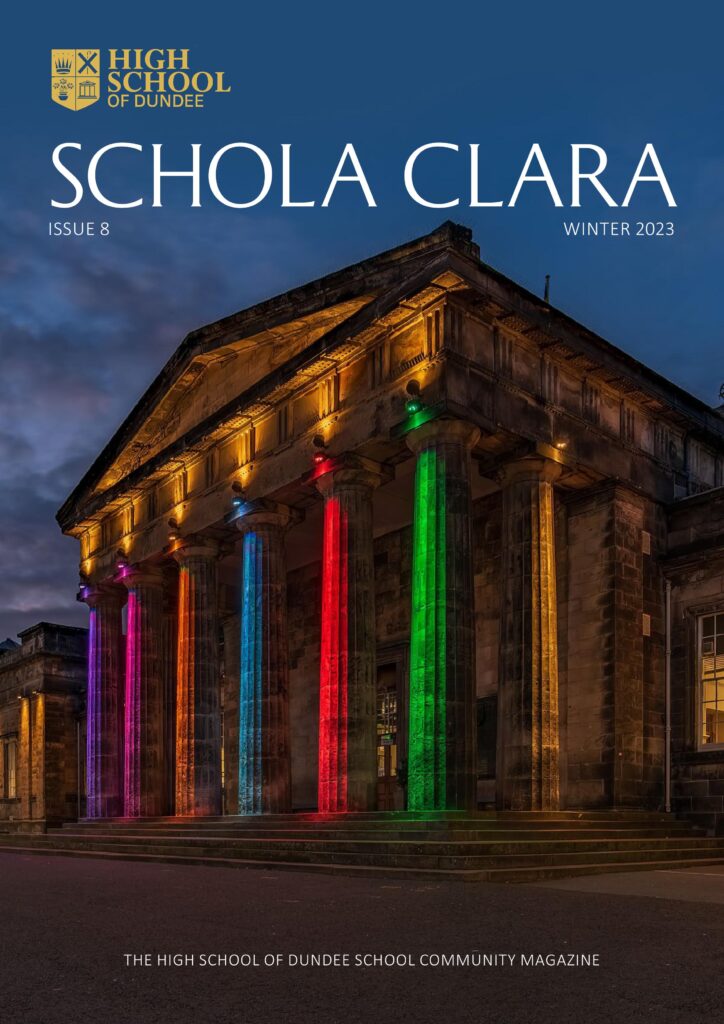 HSD SCHOLA CLARA 2023 cover. Front of Dundee school lit up with multi coloured lights.