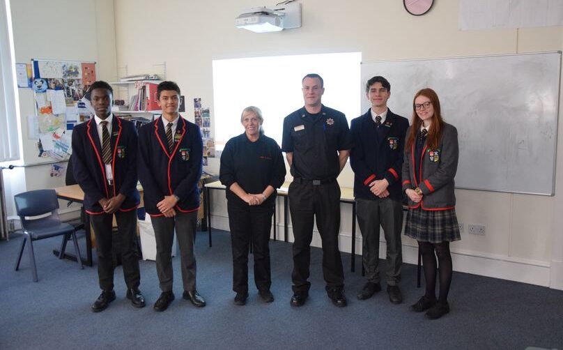 Emergency Services Bring Road Safety Talks To High School. Pupils and Emergency service first responders standing for photos at front of the class.