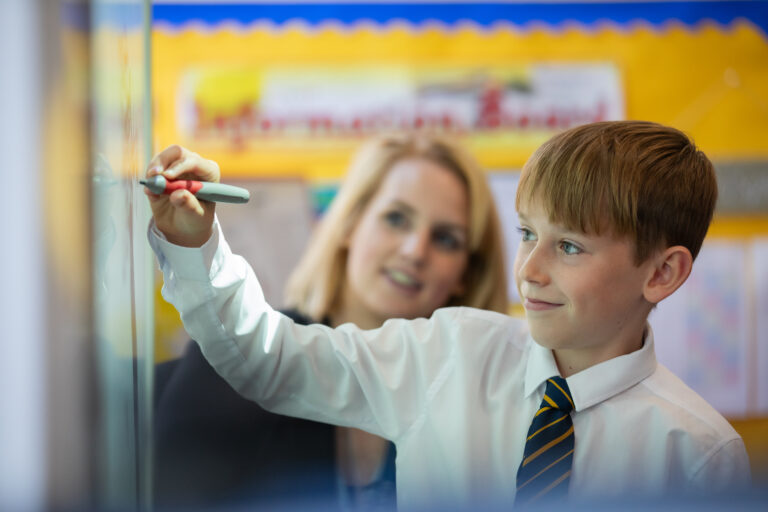 Junior Years child is engaged in learning with teacher